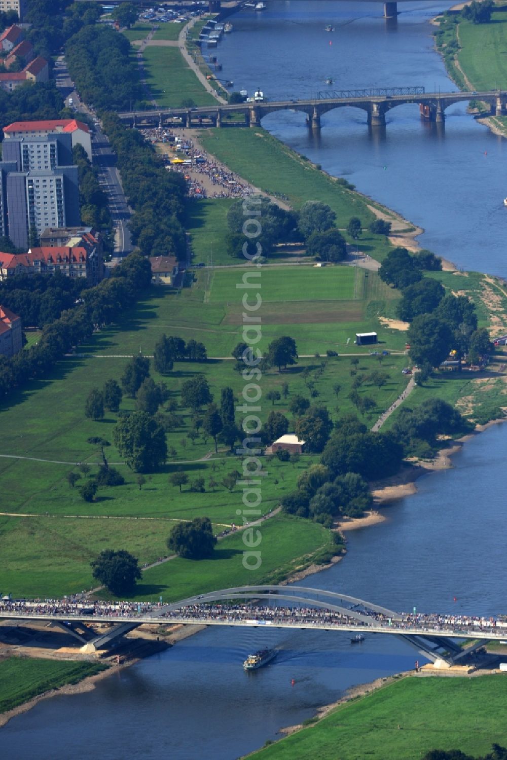 Aerial photograph Dresden - Visitors and pedestrians at the opening after completion of Waldschloesschenbrücke on the river Elbe in Dresden in Saxony