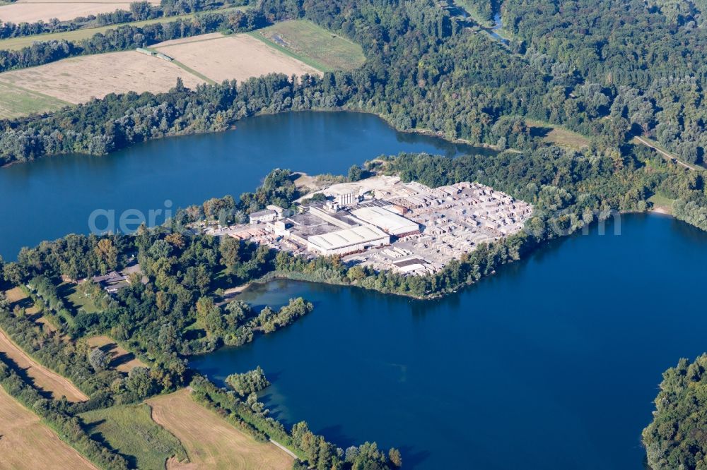 Eggenstein-Leopoldshafen from the bird's eye view: Mixed concrete and building materials factory of Lithonplus GmbH & Co. KG on lake Fuchs & Gros in Eggenstein-Leopoldshafen in the state Baden-Wuerttemberg, Germany
