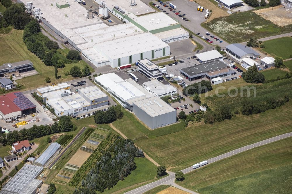 Sulz am Neckar from the bird's eye view: Building and grounds of the company Edelstahlservice Sulz GmbH in the commercial area in Sulz am Neckar in the state Baden-Wurttemberg, Germany