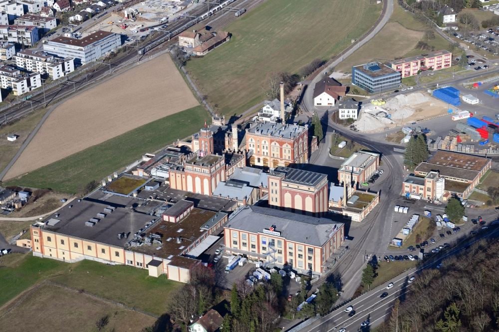 Aerial photograph Rheinfelden - Historical buildings and production halls on the premises of the brewery Feldschloesschen in Rheinfelden in the canton Aargau, Switzerland