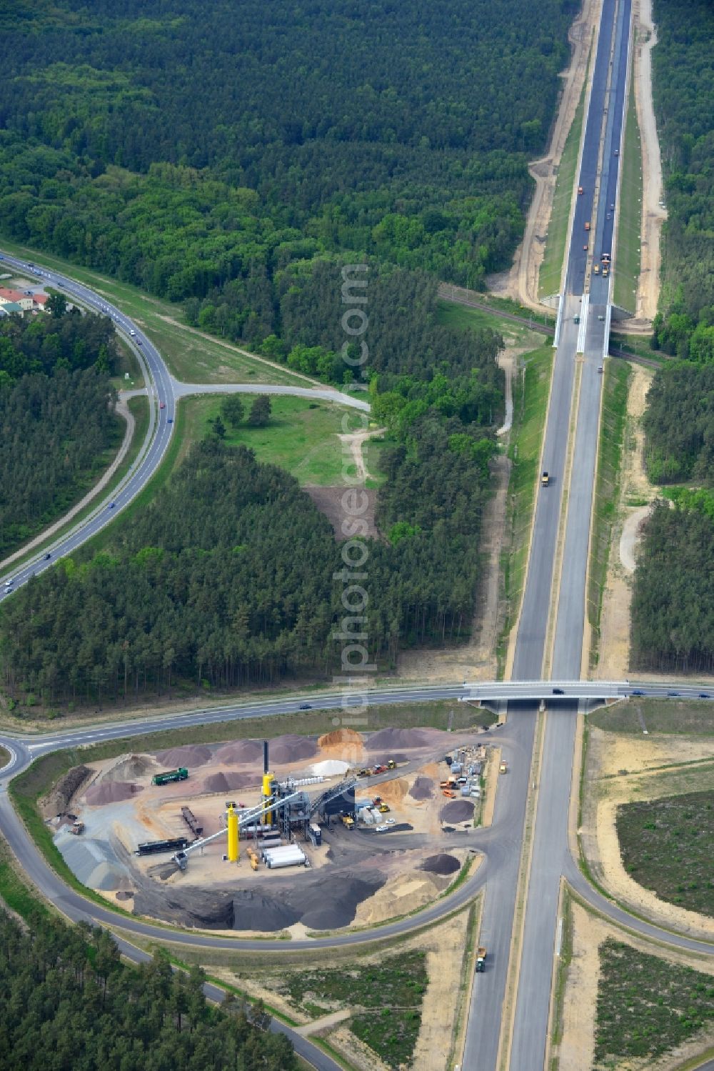 Aerial image Ludwigslust - Bitumen - mixing plant to the driving surface production to the construction site on the traffic flow on the motorway junction of the A14 motorway at exit Ludwigslust in Mecklenburg - Western Pomerania