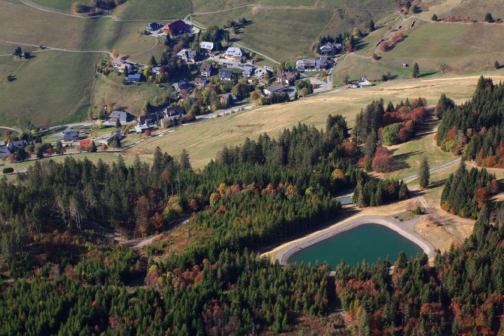 Aerial photograph Todtnau - Looking over the water reservoir for artificial snow to the village of Todtnauberg in the Black Forest in the state Baden-Wurttemberg, Germany