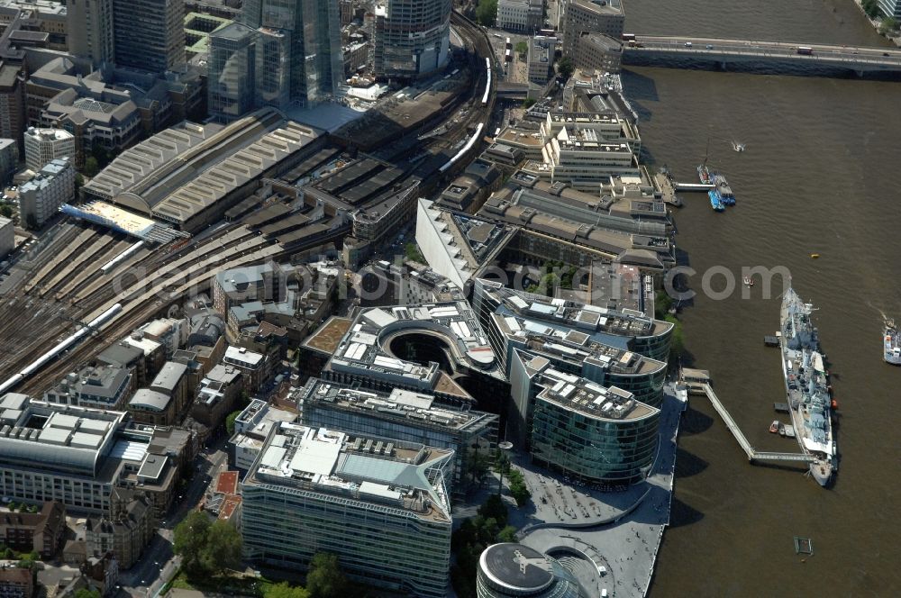 Aerial photograph Riverside Ward - View of the British warship HMS Belfast on the Thames in London. The ship, which was built in 1936 and belongs to the Town-class, was the largest light cruiser of the Royal Navy during World War II. It is anchored on the Thames and is now a museum