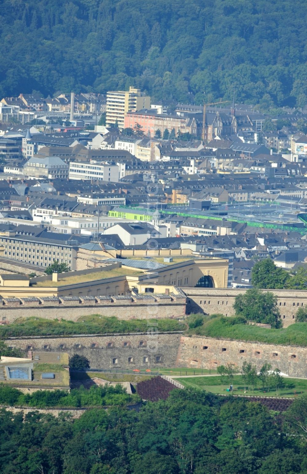 Koblenz from the bird's eye view: View of the fort Ehrenbreitstein across from the mouth of the Moselle near Koblenz. The fortification, which has existed since the 16. century, was used by the Prussian army until 1918 and is now owned by the state of Rhineland-Palatinate. It houses the State Museum Koblenz, the hostel Koblenz, the memorial of the German land forces as well as various administrative agencies. Since 2002, the fortress is a UNESCO World Heritage Upper Middle Rhine Valley, and cultural property protected under the Hague Convention