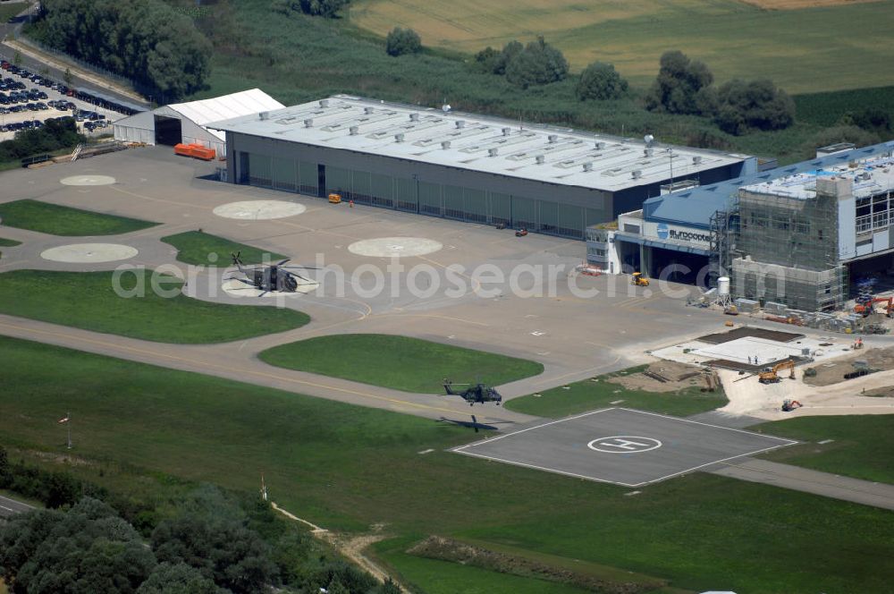 Aerial photograph Donauwörth - Blick auf das Gelände eines Hubschrauber-Produzenten in Donauwörth. Es ist die deutsche Zentrale des deutsch-französischen Herstellers Eurocopter. Das Unternehmen ist Weltmarktführer bei zivilen Hubschraubern. Adresse: Industriestr. 4, 86609 Donauwörth, +49 (0)906 714011, Homepage