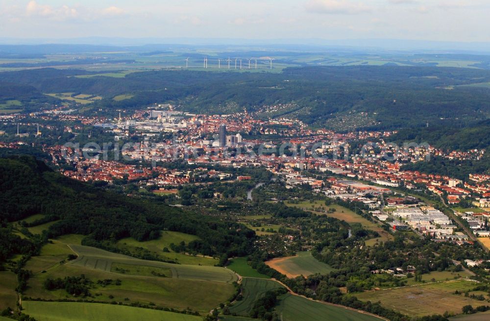 Aerial image Jena - Also from the north-east are the dominant of the new buildings at the Ernst-Abbe-Platz in the center of Jena in Thuringia the determining element. With the Jentower and the skyscraper B59 the center of the city is highlighted. In the foreground of the hillsides of Jenzig are left to be seen. In the valley in front of the Saale winds and at its west bank of the industrial area Zwaetzen is located. In the background, the bright large buildings belonging to the premises from SCHOTT technology group
