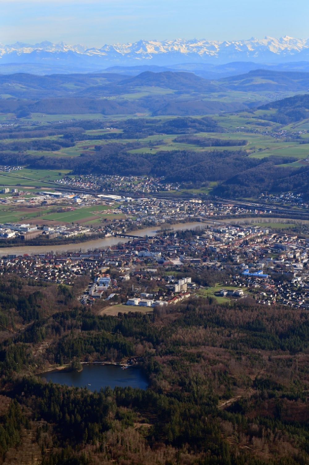 Bad Säckingen from above - City area and river Rhine in Bad Saeckingen in the state Baden-Wurttemberg, Germany. Clear view over Switzerland to the mountain range of the Swiss Alps
