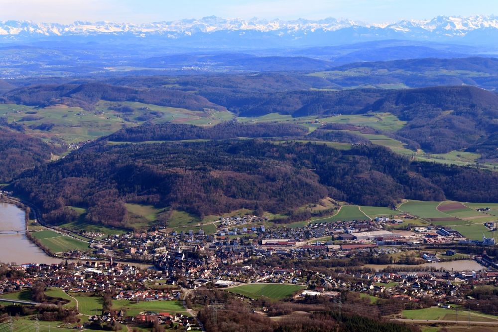 Laufenburg from above - City area and river Rhine in Laufenburg in the state Baden-Wurttemberg, Germany. Clear view over Switzerland to the mountain range of the Swiss Alps