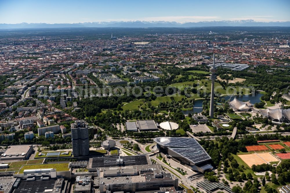 München from above - The BMW Welt is a combined exhibition, delivery, adventure, museum and event venue in Munich in Bavaria and is part of the corporate headquarters of the car manufacturer BMW. In the so-called brand world, an exhibition pavilion, the current models of BMW, MINI, Rolls-Royce Motor Cars and BMW Motorrad, innovations and technology are presented