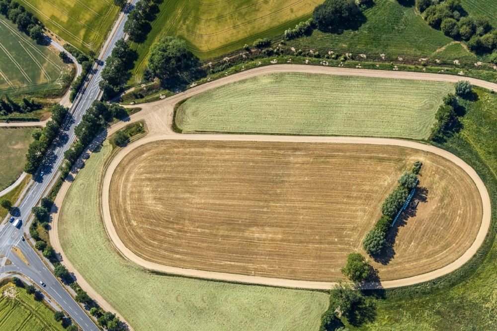 Aerial photograph Moers - Traces of tillage due to drill marks in the seed and tillage on an agricultural field in Moers in the state North Rhine-Westphalia, Germany