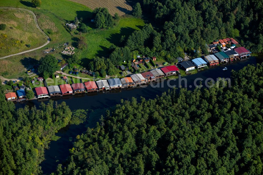 Aerial image Mirow - Boat House ranks with the recreational marine jetties and boat mooring area on the banks of the canal of the Mecklenburg Lake District in Mirow in the state Mecklenburg - Western Pomerania, Germany