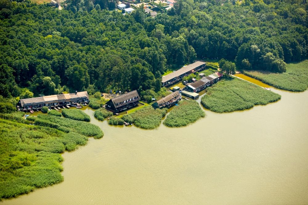 Aerial photograph Seedorf - Boat House ranks with the recreational marine jetties and boat mooring area on the banks des Malchiner Sees in Seedorf in the state Mecklenburg - Western Pomerania