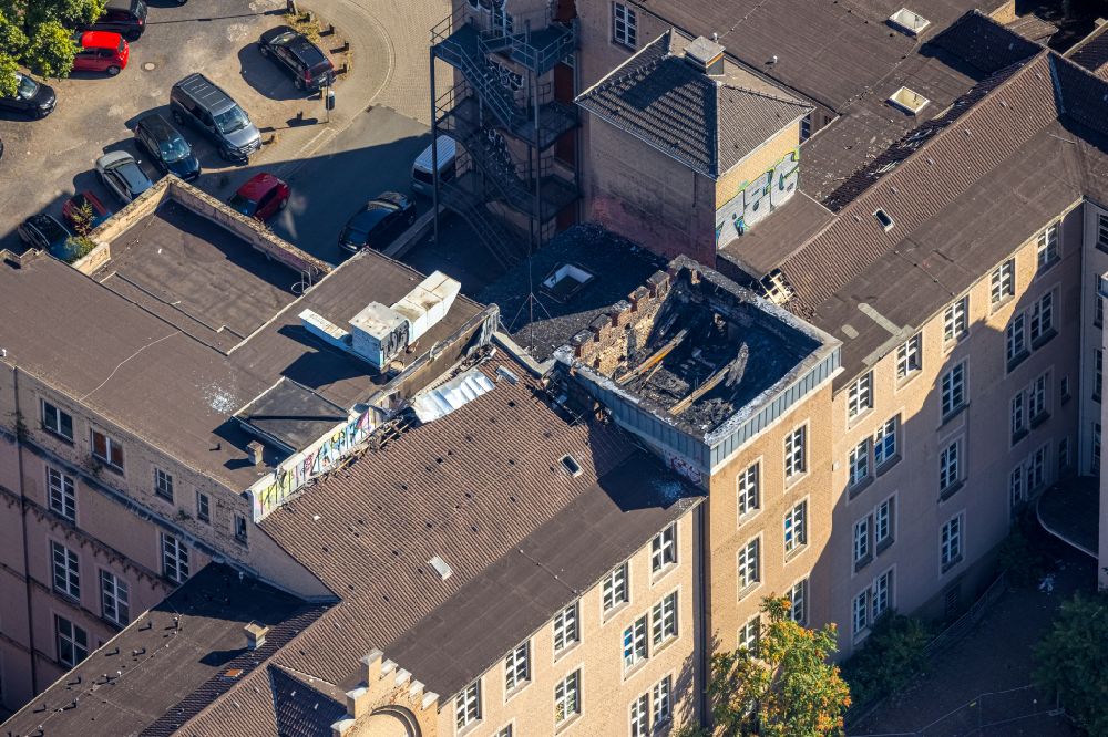 Duisburg from above - Fire ruins in the roof structure of the former St. Vincenz-Hospital on Musfeldstrasse in the district Dellviertel in Duisburg in the Ruhr area in the state North Rhine-Westphalia, Germany