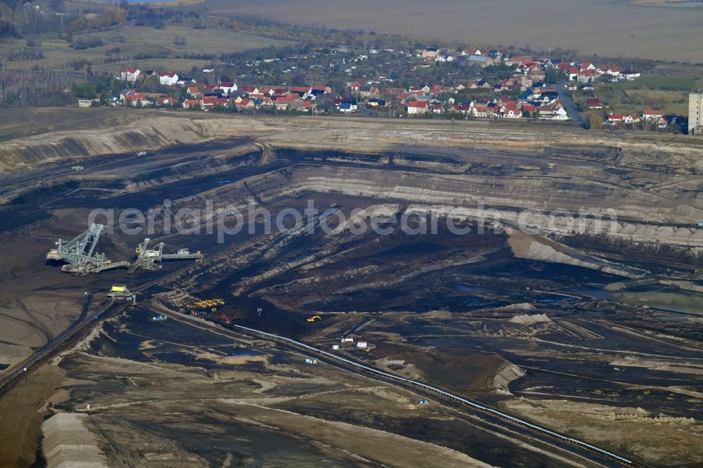 Amsdorf from the bird's eye view: Mining area - terrain and overburden surfaces of coal - opencast mining in Amsdorf in the state Saxony-Anhalt, Germany