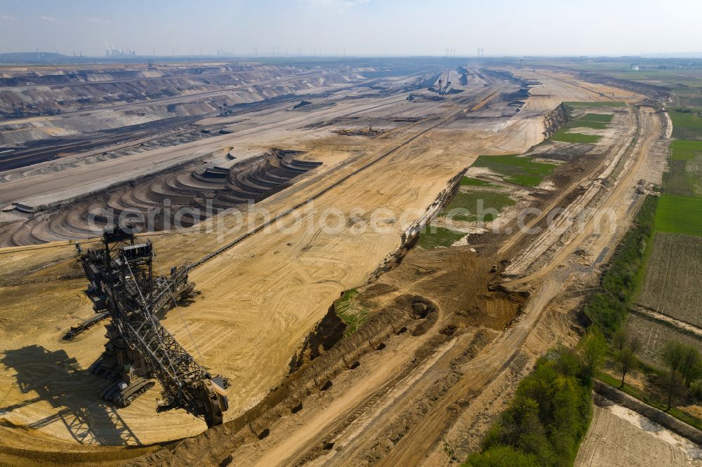 Jüchen from above - Mining area - terrain and overburden surfaces of coal - opencast mining Tagebau Garzweiler in Juechen in the state North Rhine-Westphalia, Germany