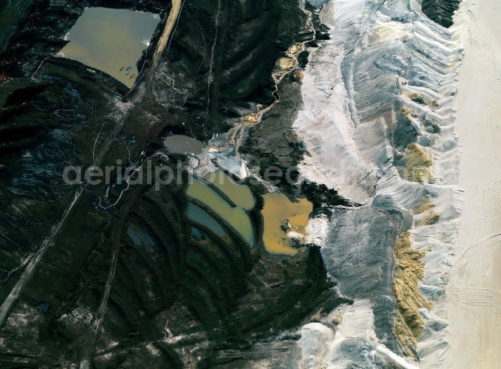 Aerial image Inden - Der Tagebau Inden ist ein Tagebau der RWE Power AG zur Gewinnung von Braunkohle. Er liegt im Rheinischen Braunkohlerevier nahe Inden. Der Tagebau erstreckt sich zwischen der Gemeinde Aldenhoven und der A 44. Brown coal mining near Inden in North Rhine-Westphalia.
