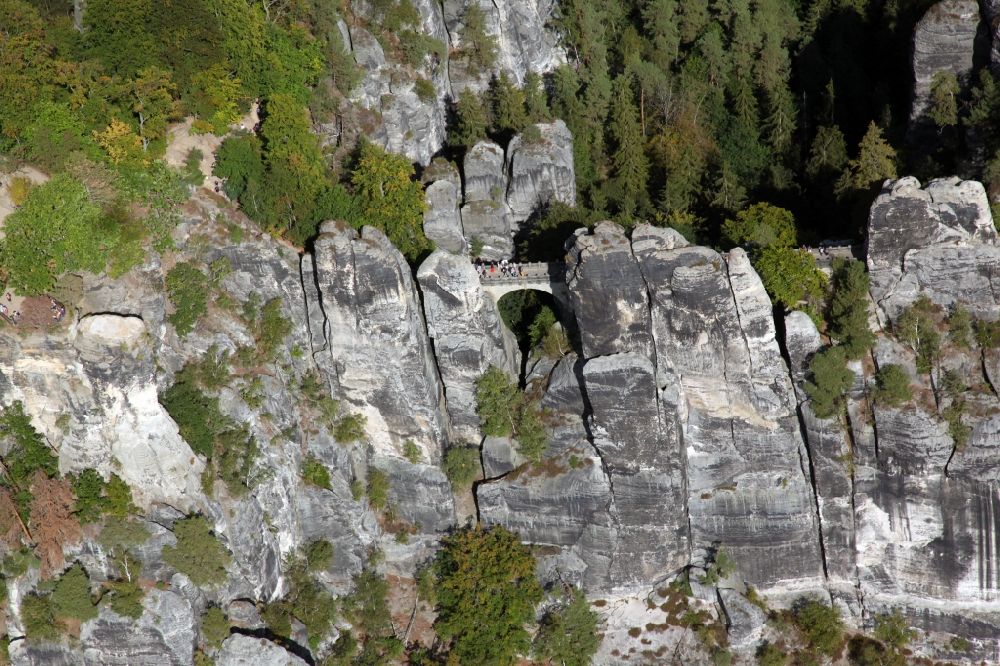 Aerial photograph Rathen - Bridge construction of the Bastei Bridge in Rathen in the state Saxony. The Bastei is a rock formation with a viewing platform in Saxon Switzerland on the right bank of the Elbe in the area of the municipality of Lohmen between the health resort Rathen and the city of Wehlen