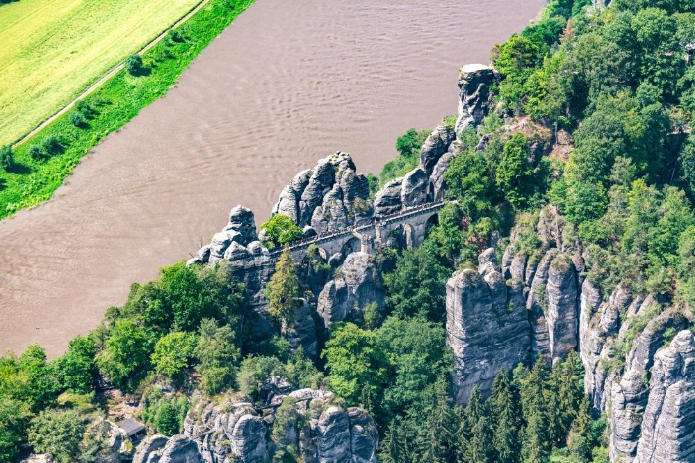 Aerial image Lohmen - Bridge construction of the Bastei Bridge in Rathen in the state Saxony. The Bastei is a rock formation with a viewing platform in Saxon Switzerland on the right bank of the Elbe in the area of the municipality of Lohmen between the health resort Rathen and the city of Wehlen