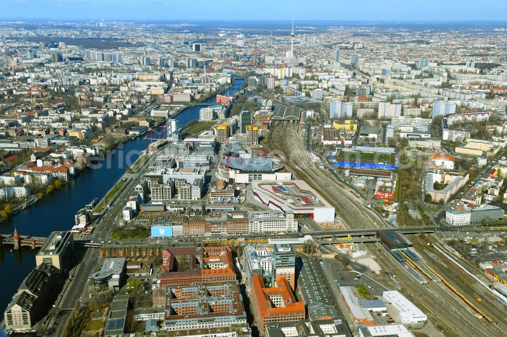 Berlin from above - Construction site on building of the monument protected former Osram respectively Narva company premises Oberbaum City in the district Friedrichshain in Berlin. Here, among many other companies, BASF Services Europe, the German Post Customer Service Center GmbH and Heineken Germany GmbH are located. It is owned by HVB Immobilien AG, which is part of the UniCredit Group
