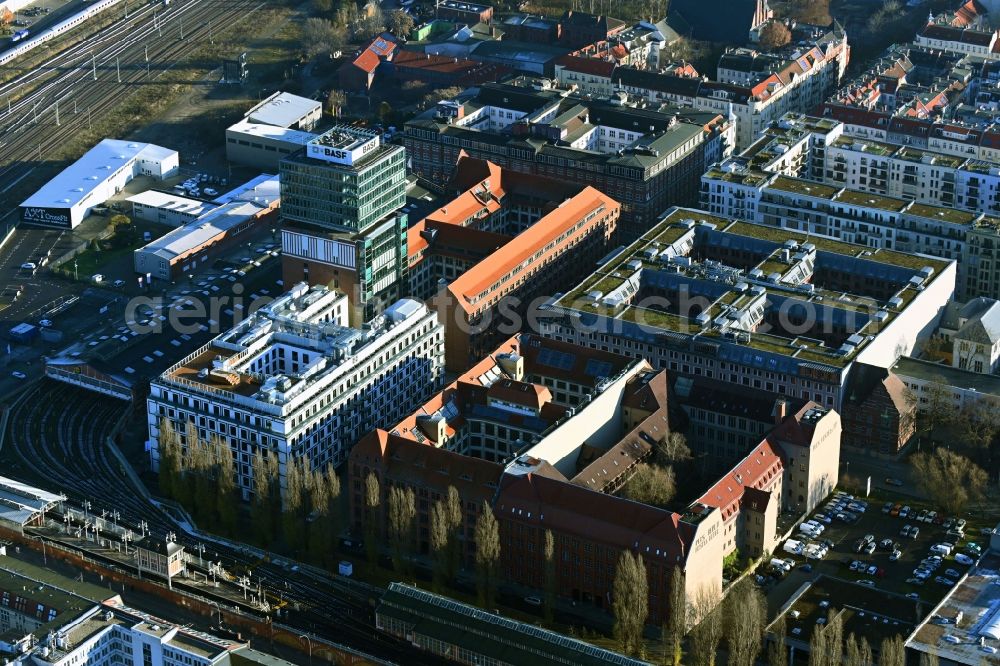 Berlin from above - Construction site on building of the monument protected former Osram respectively Narva company premises Oberbaum City in the district Friedrichshain in Berlin. Here, among many other companies, BASF Services Europe, the German Post Customer Service Center GmbH and Heineken Germany GmbH are located
