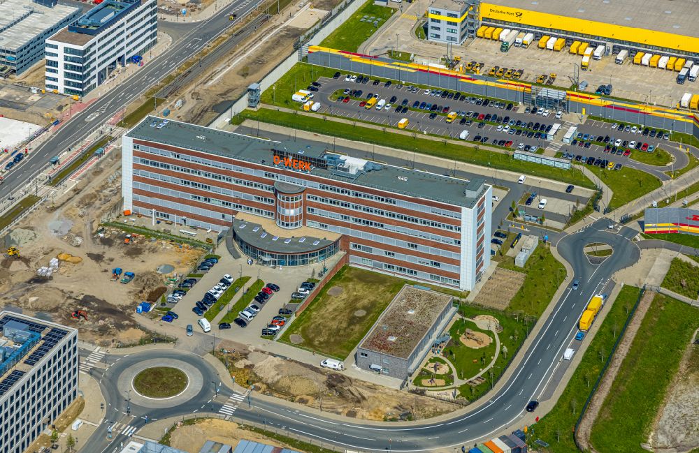 Aerial image Bochum - Office and commercial building O-Werk and construction of the new road on Opelring overlooking the other construction sites in the development area MARK 51A?7 on street Suttner-Nobel-Allee in the district Laer in Bochum at Ruhrgebiet in the state North Rhine-Westphalia, Germany
