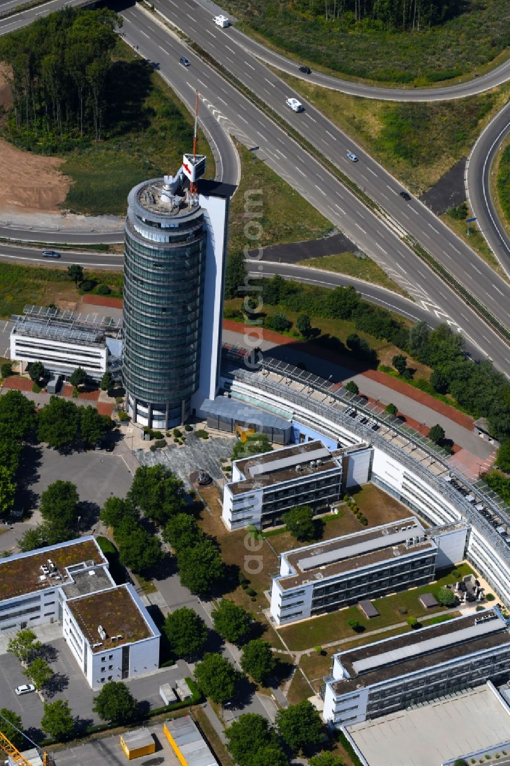Neckarsulm from the bird's eye view: Office and corporate management high-rise building of Fujitsu TDS GmbH on Konrad-Zuse-Strasse in Neckarsulm in the state Baden-Wurttemberg, Germany