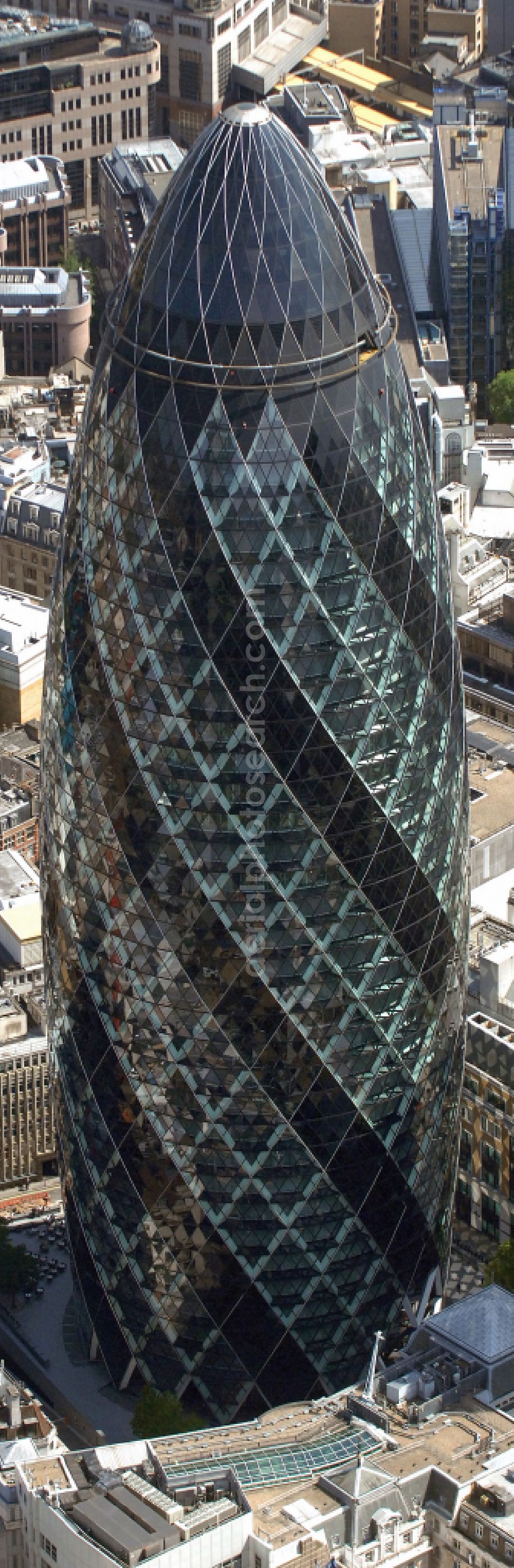London from the bird's eye view: Office and corporate management high-rise building The Gherkin on street Saint Mary Axe in London in England, United Kingdom