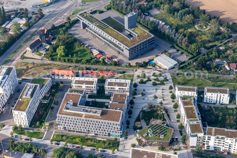 Heidelberg from the bird's eye view: Office building of Deutsche Wohnwerte GmbH & Co. KG in front of the fire brigade centre in the district Bahnstadt in Heidelberg in the state Baden-Wurttemberg, Germany