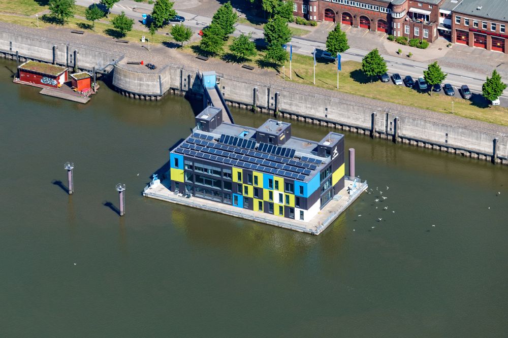 Hamburg from the bird's eye view: Office building of the administration and commercial building on the bank of the river course of the Elbe on the street Am Zollhafen in the district Veddel in Hamburg, Germany