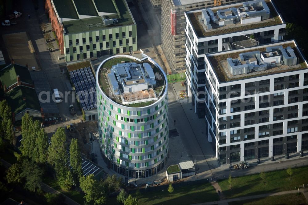 Aerial image Berlin - Office and research buildings on EUREF-Campus in the Schoeneberg part of Berlin in Germany. The architectural distinct buildings on the traditional and historic industrial site at the Gasometer of Berlin are used as event locations, offices and residential buildings
