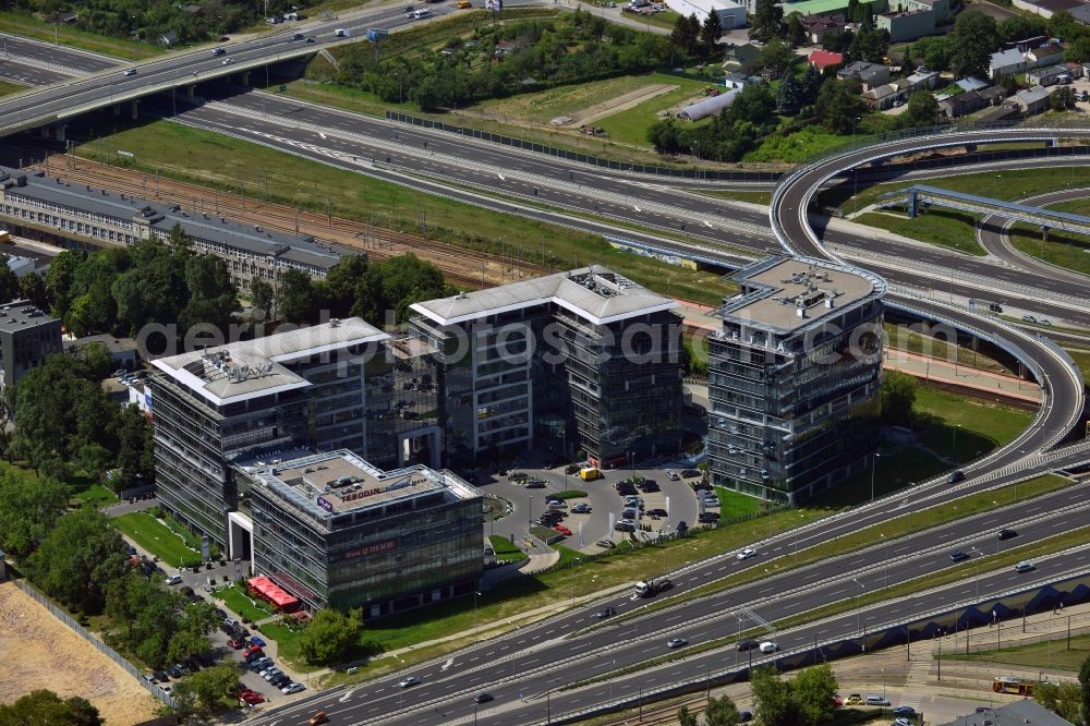 Warschau from above - Office building complex Sluzewiec in the Mokotow District in Warsaw in Poland. The complex is located on the newly built traffic junction of the highway S79 in the west of the district. Its main tenants are the consultany and engineering company Tebodin and the telecommunications provider Netia S.A. which is located in the L-shaped building