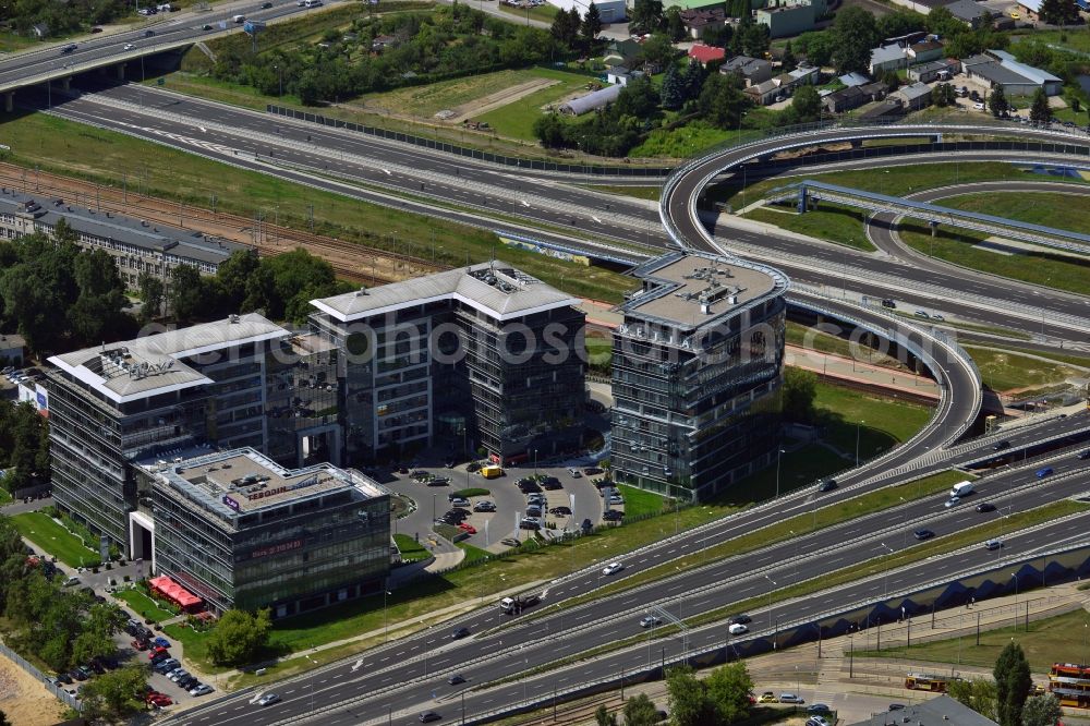 Warschau from the bird's eye view: Office building complex Sluzewiec in the Mokotow District in Warsaw in Poland. The complex is located on the newly built traffic junction of the highway S79 in the west of the district. Its main tenants are the consultany and engineering company Tebodin and the telecommunications provider Netia S.A. which is located in the L-shaped building