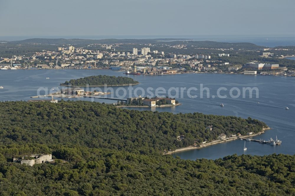 Aerial image Pula - Water surface at the bay along the sea coast Adriatic Sea in Pula in Istirien - Istarska zupanija, Croatia