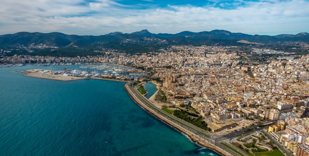 Aerial photograph Palma - Water surface at the bay along the marine coast of the Balearic Sea with a view of the city and port in the Llevant de Palma District in Palma in Balearic Island Mallorca, Spain