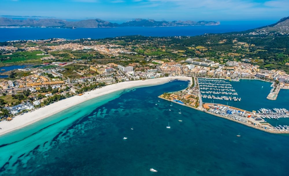 Aerial image Alcudia - Water surface at the bay along the sea coast with Port d'AlcA?dia in Alcudia in Balearic island of Mallorca, Spain