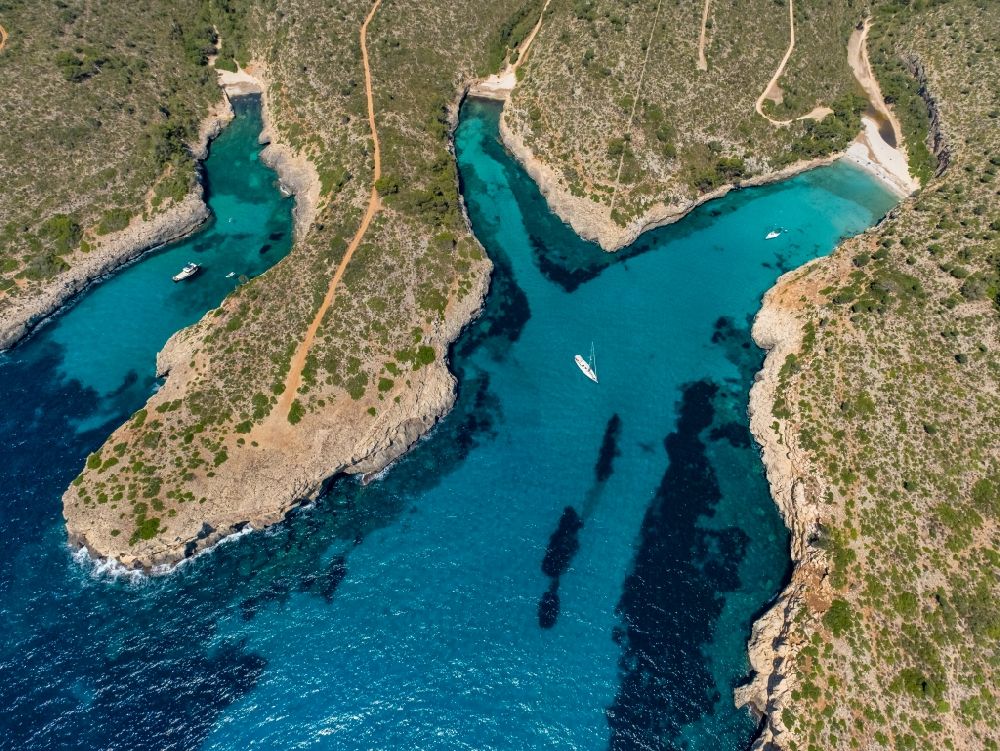 Aerial image Manacor - Water surface at the bay along the sea coast Illes Balears in Manacor in Balearic island of Mallorca, Spain