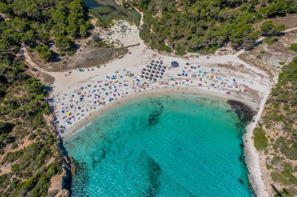 Aerial image Cala Santanyi - Water surface at the bay along the sea coast Playa de SantanyA? in Cala Santanyi in Balearische Insel Mallorca, Spain