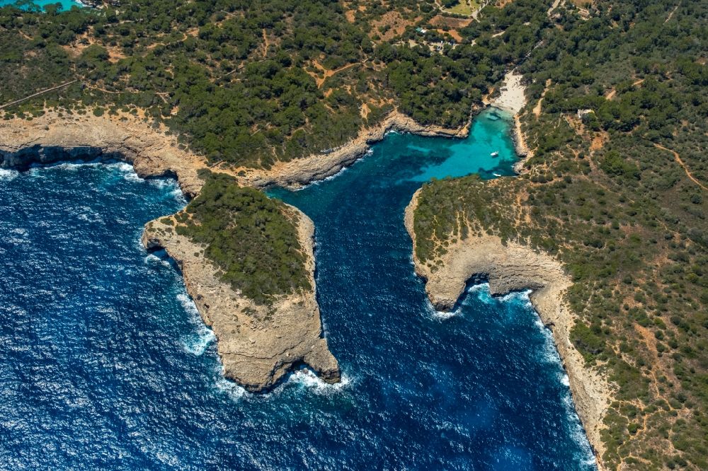 Aerial photograph Felanich - Water surface at the bay along the sea coast with the beach of the bay Cala Sa Nau in Felanich in Balearic island of Mallorca, Spain