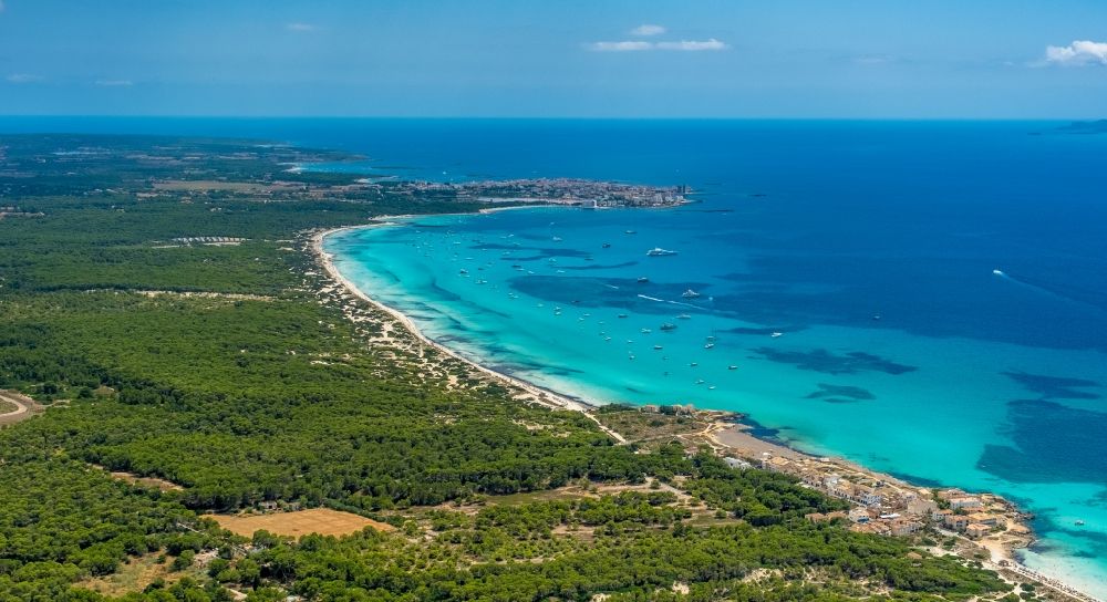 Aerial image Campos - Water surface at the bay along the sea coast of the beach Platja of Trenc in Campos in Islas Baleares, Spain