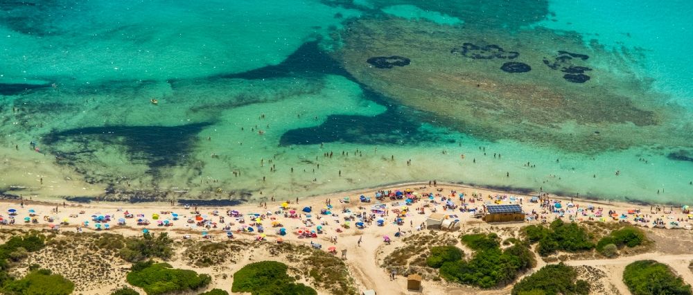 Campos from above - Water surface at the bay along the sea coast of the beach Platja of Trenc in Campos in Islas Baleares, Spain