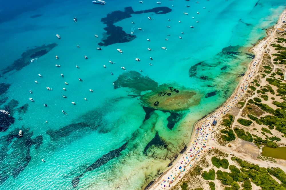 Aerial image Campos - Water surface at the bay along the sea coast of the beach Platja of Trenc in Campos in Islas Baleares, Spain