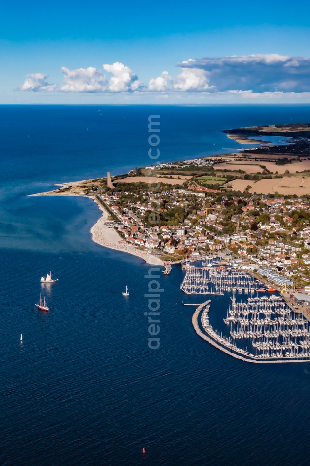 Laboe from above - Bay along the sea coast with marina and commercial port on the Kieler Foerde in Laboe in the state Schleswig-Holstein, Germany. The Laboe Baltic Bay Hafen combines maritime trade in the south-western port area