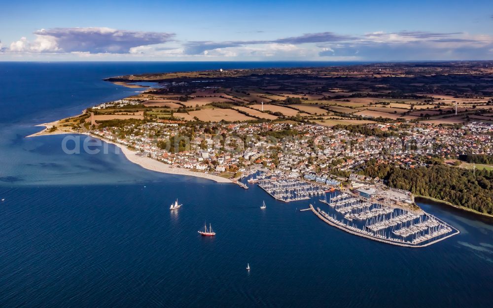 Aerial image Laboe - Bay along the sea coast with marina and commercial port on the Kieler Foerde in Laboe in the state Schleswig-Holstein, Germany. The Laboe Baltic Bay Hafen combines maritime trade in the south-western port area