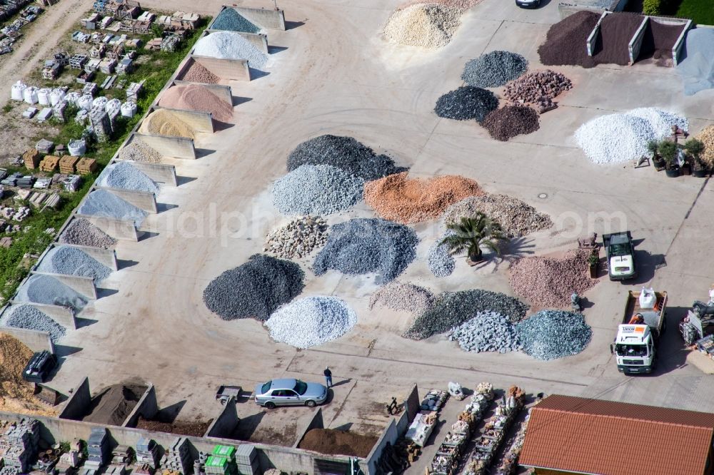 Aerial photograph Hagenbach - Colourful gravel and stone depot of Palatinum Landschafts u.Gartendesign in the district Daxlanden in Hagenbach in the state Rhineland-Palatinate