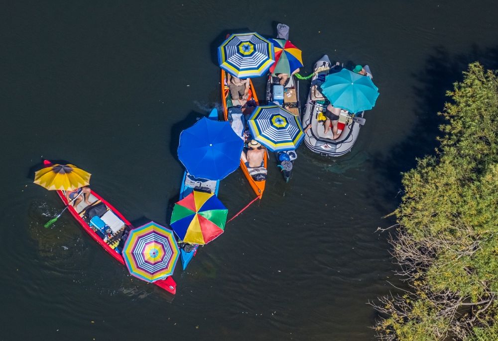 Aerial image Dorsten - Colorful picnic under parasols in boats on the water wall on the Lippe in the district of Hervest in Dorsten in the state North Rhine-Westphalia, Germany