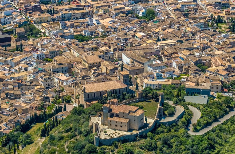 Arta from above - Castle of the fortress Almudaina d'Arta on C. del Castellet and the church building in Arta in Balearic island of Mallorca, Spain