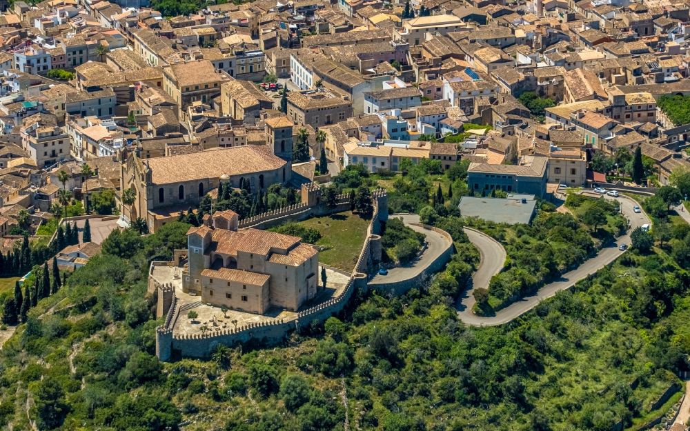 Arta from the bird's eye view: Castle of the fortress Almudaina d'Arta on C. del Castellet and the church building in Arta in Balearic island of Mallorca, Spain