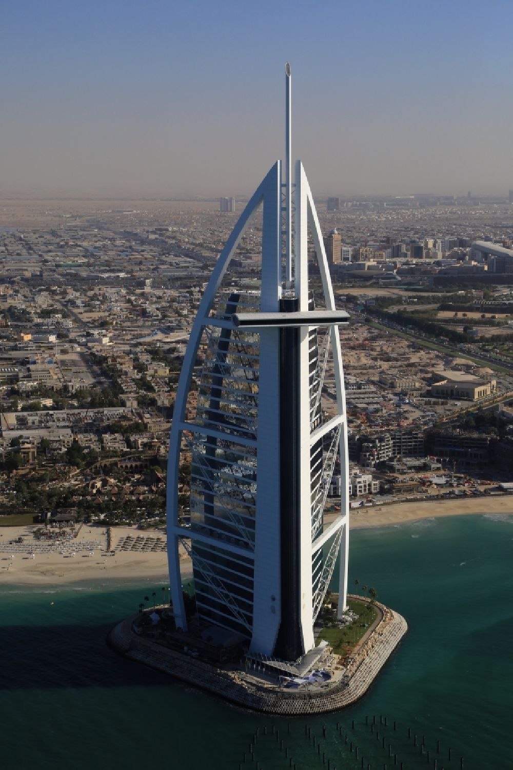 Aerial image Dubai - Burj Al Arab is landmark and symbol of Dubai in United Arab Emirates