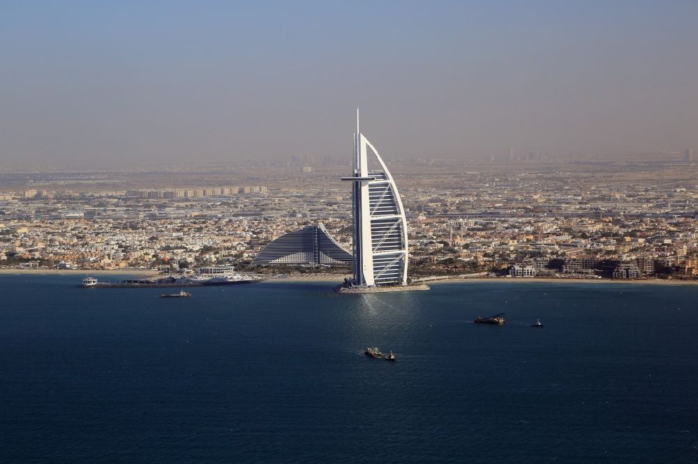 Aerial image Dubai - Burj Al Arab and Jumeirah Beach Hotel are landmark and symbol of Dubai in United Arab Emirates