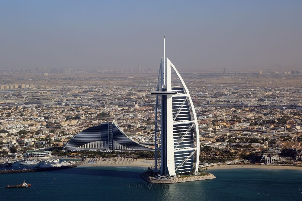 Aerial photograph Dubai - Burj Al Arab and Jumeirah Beach Hotel are landmark and symbol of Dubai in United Arab Emirates